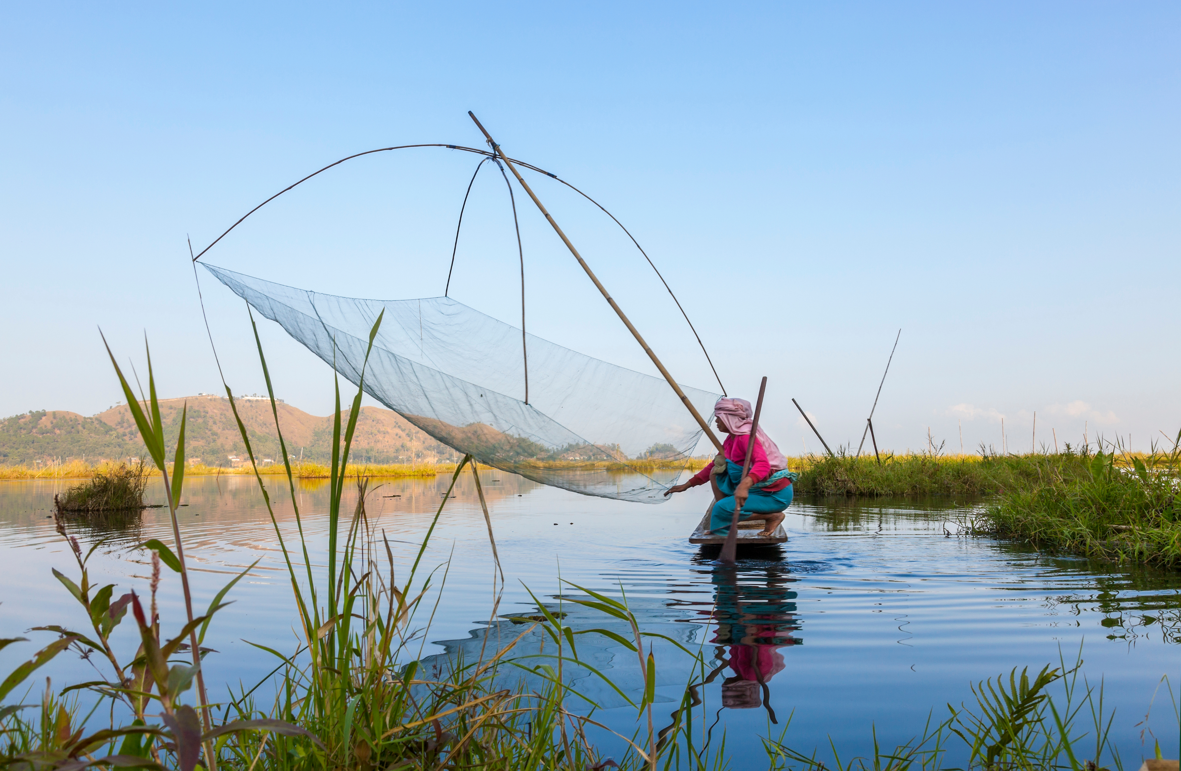 Fisherman on traditional fishing boat