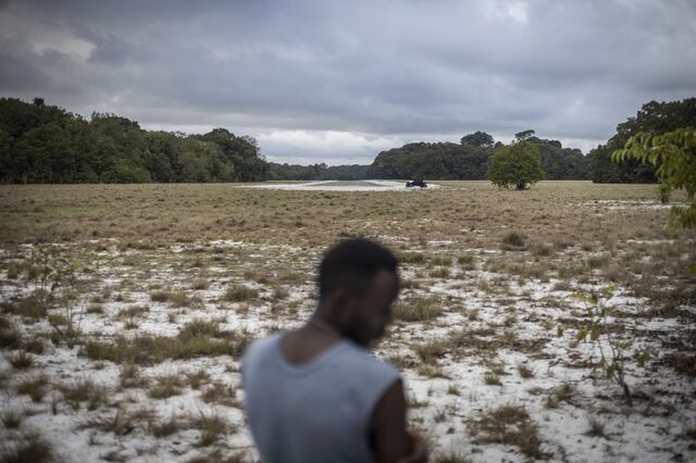 A man stands in front of the 1km airstrip under construction at a 20-bed eco-lodge under construction at Petit Loango on the coastline of Gabon’s flagship Loango National Park on October 12, 2022. Based around the forestLAB research centre based at Petit Loango, the lodge aims to set a benchmark for nature-based tourism in Equatorial Africa.